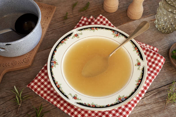 istock Chicken bone broth in a soup bowl on a table 1863140965