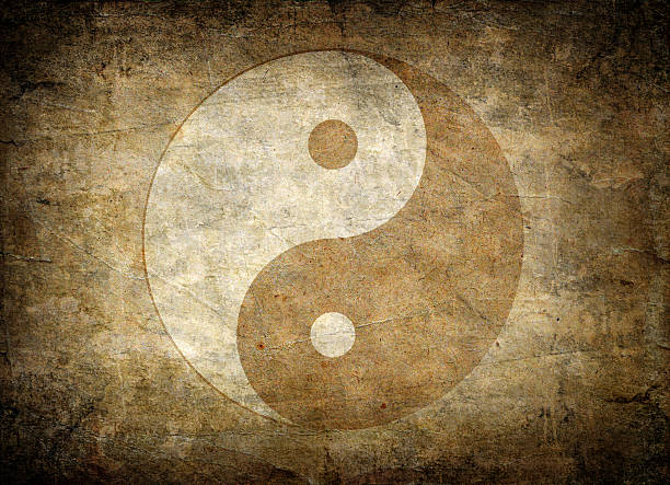 Faded away image of the symbol of balance, yin yang Very old Yin Yang symbol on dirty paper yin yang symbol stock pictures, royalty-free photos & images