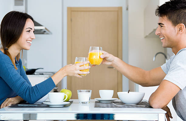 istock Young Couple Enjoying Breakfast in the kitchen 186314421