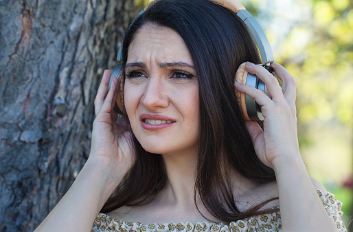 Young woman having hearing loss