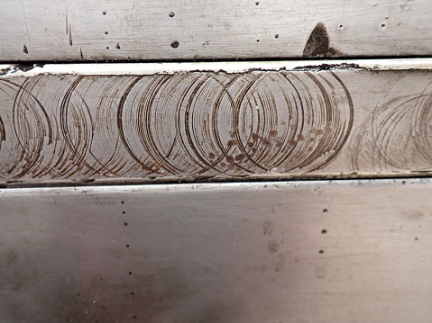 Scratched metal plate on board the Flying Scotsman Steam Train, workers marks