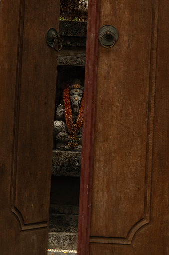 Ganesha figure behind the door in Bali