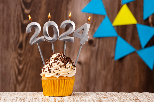 Happy New Year 2024 - Wooden background with pennants