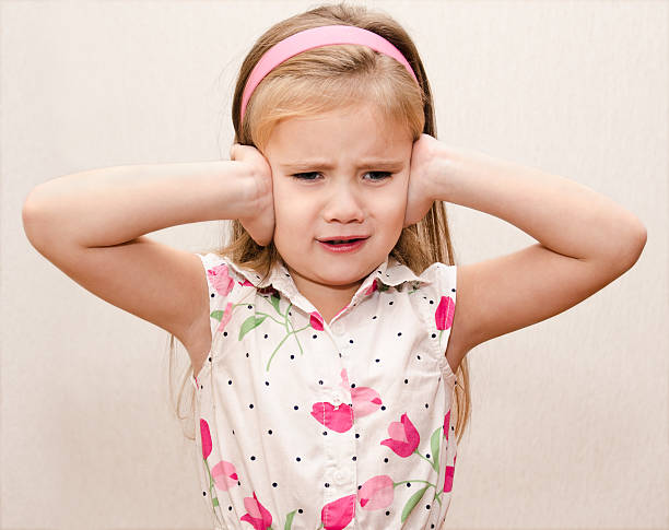 istock Little girl covering her ears 186317404