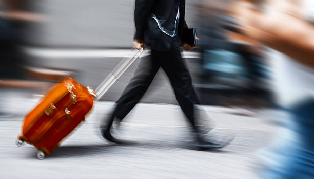 istock Businessman with red suitcase in a hurry 186317480