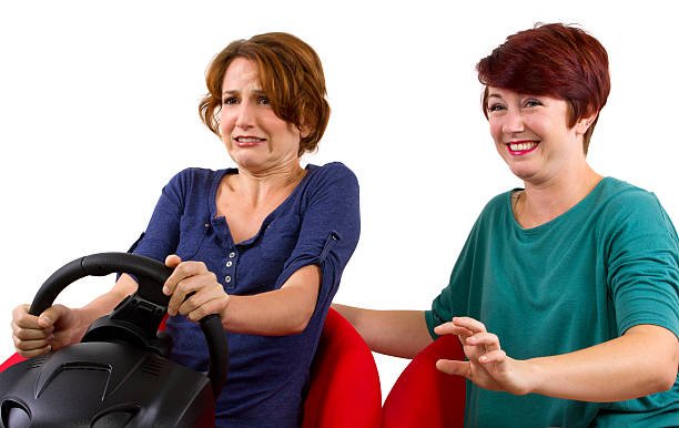 Reckless driver and scared female passenger on white background