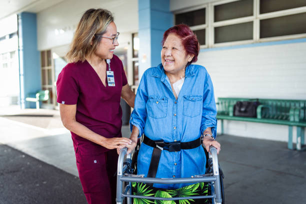istock Caring occupational therapist helping elderly patient walk with transfer gait belt 1863176979