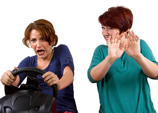 Reckless driver and scared female passenger on white background