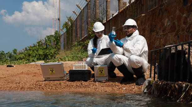 istock Male and female biologists analyze water test results and keep samples for examining 1863183034