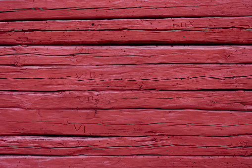 red wood wall, background. painted old red wooden wall. red background.