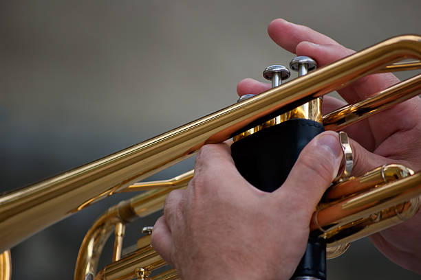 istock hands holding golden trumpet 186319641