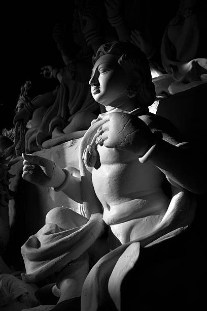 Black and white photograph of cemetery artwork consisting of a winged angel