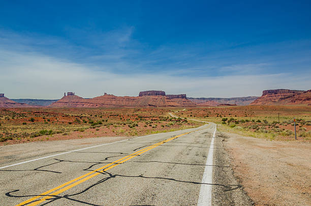 istock Winding Road Through a Desert and Blue Sky 186320147