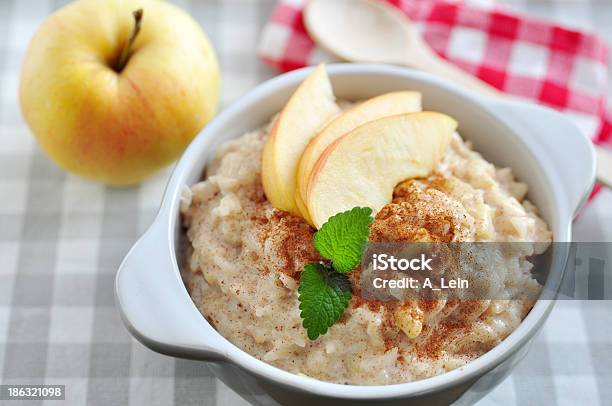 Milk Rice Pudding With Apple And Cinnamon Stock Photo - Download Image Now - Rice Pudding, Apple - Fruit, Porridge