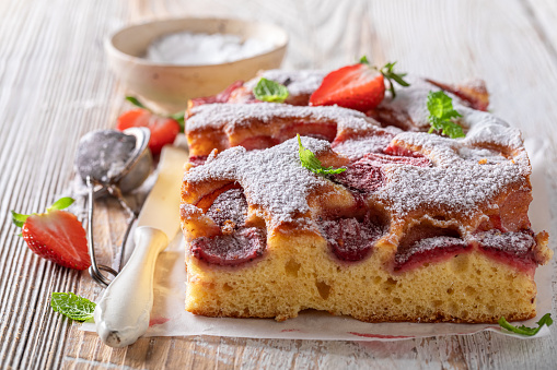 Homemade strawberry sponge cake as summer dessert. Sponge cake with strawberries.