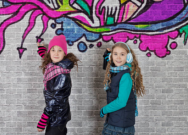 istock Girls with spray can and wall 186322879