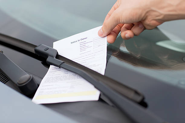 parking ticket or fine on car windscreen stock photo