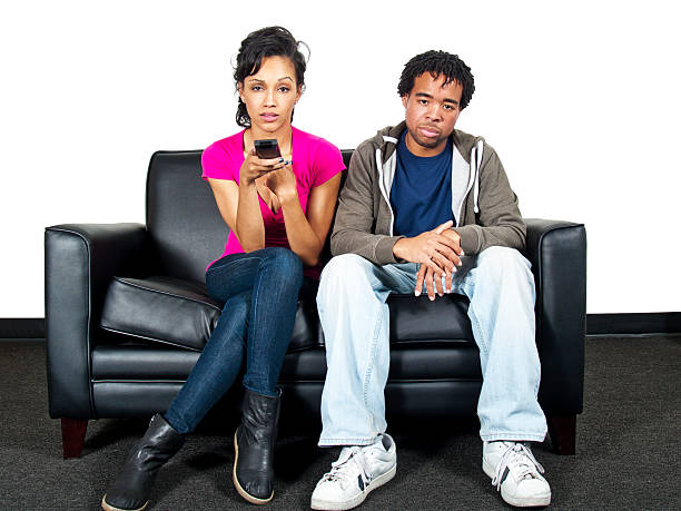 istock Young Black Couple Watching TV on a Couch 186323989