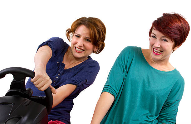 istock Two young female driving on a road trip 186324376