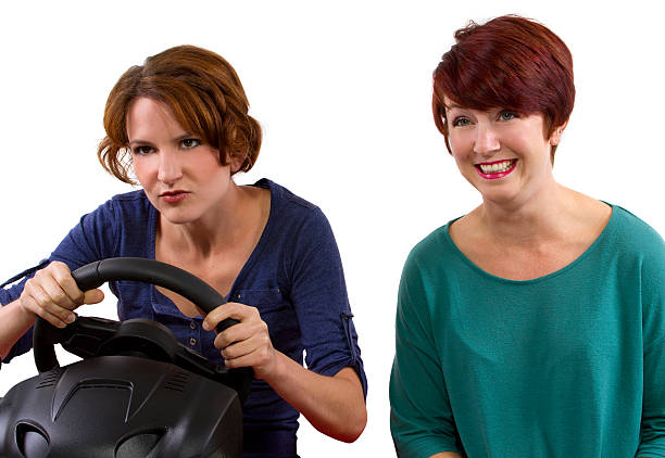 istock Two young female driving on a road trip 186324381