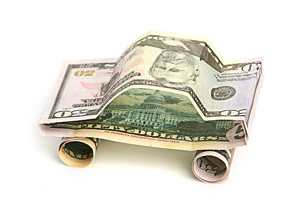 istock car made from dollar isolated on white background 186324541