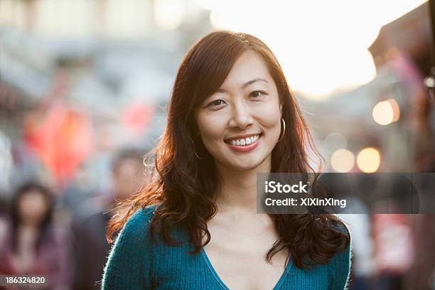 Portrait Of Smiling Mid Adult Woman In Houhai Beijing Stock Photo - Download Image Now