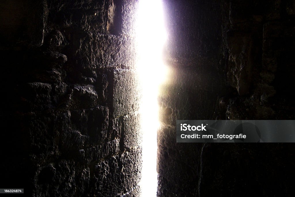 Through the Crack Caernarfon Castle in North Wales, was the setting for the Investiture of Prince Charles as Prince of Wales. Abstract Stock Photo
