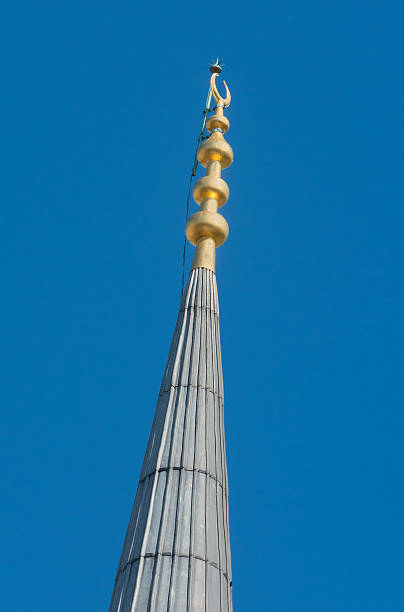 istock Minaret spire with gold crescent in closeup 186325095