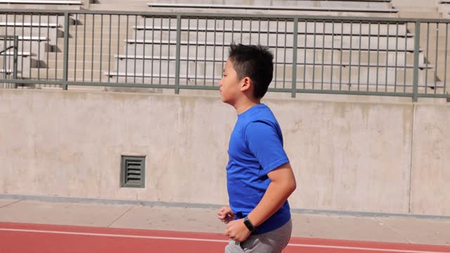 Boy Running On School Track