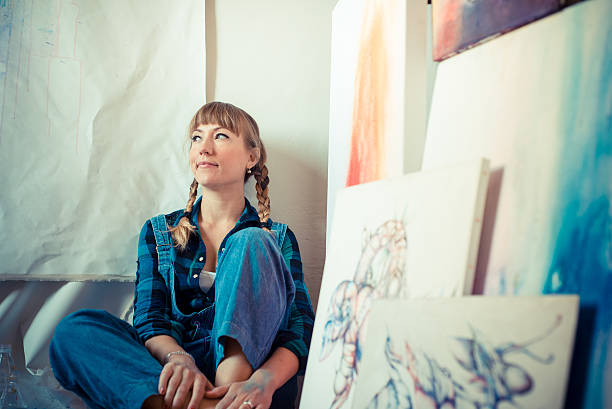 istock beautiful blonde woman painter 186328536