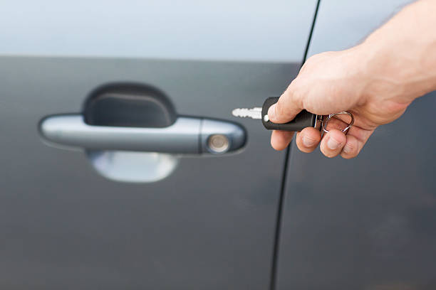istock man with car key outside 186329489