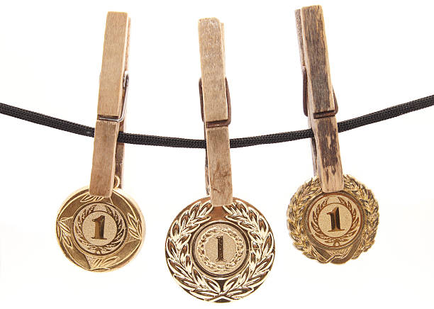 istock medal, clothespin and rope on a white background 186329896