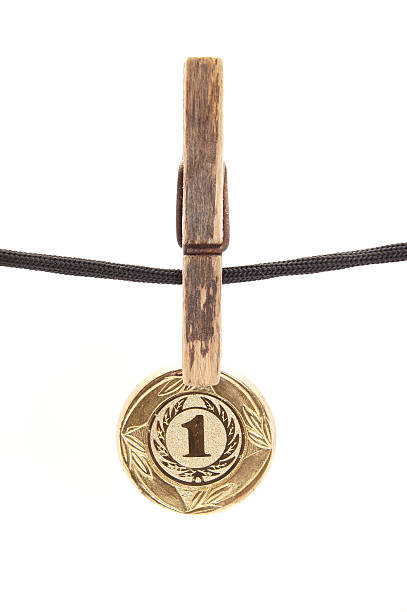 istock medal, clothespin and rope on a white background 186331164