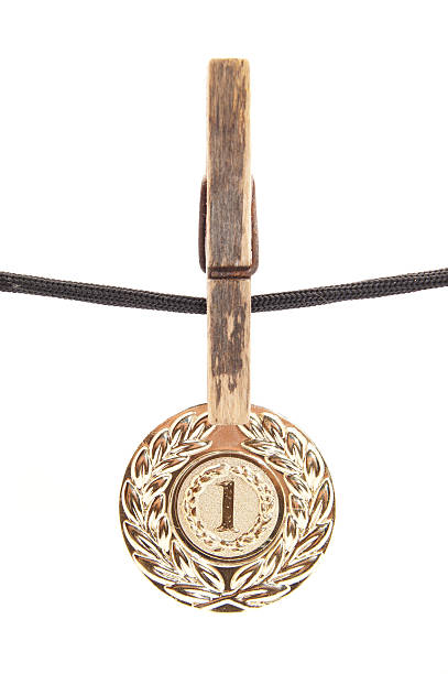 istock medal, clothespin and rope on a white background 186331180