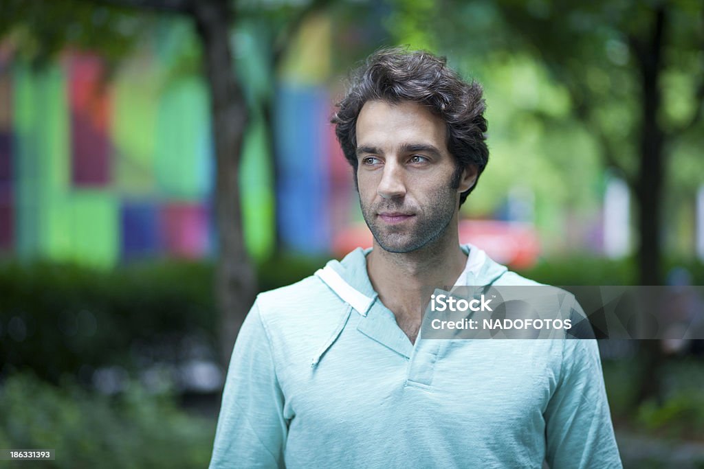 Worried Man Walking In The Park Worried Man Walking Alone In The Park 30-39 Years Stock Photo