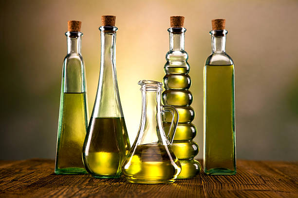 Olive oil in different shaped bottles stock photo