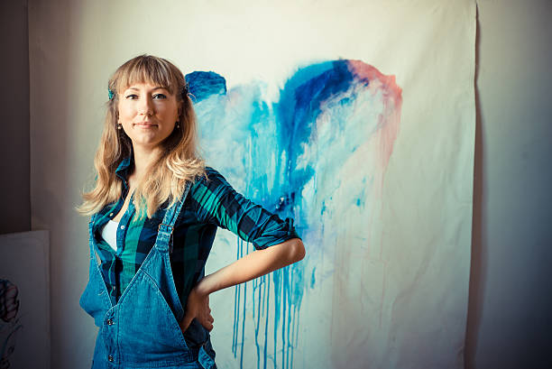 istock beautiful blonde woman painter 186332150