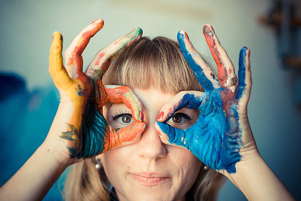 istock beautiful blonde woman painter 186333564