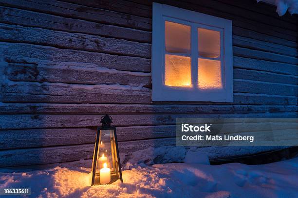 Lantern Outside A Cottage With Frosty Window Stock Photo - Download Image Now - Window, Frost, Candle