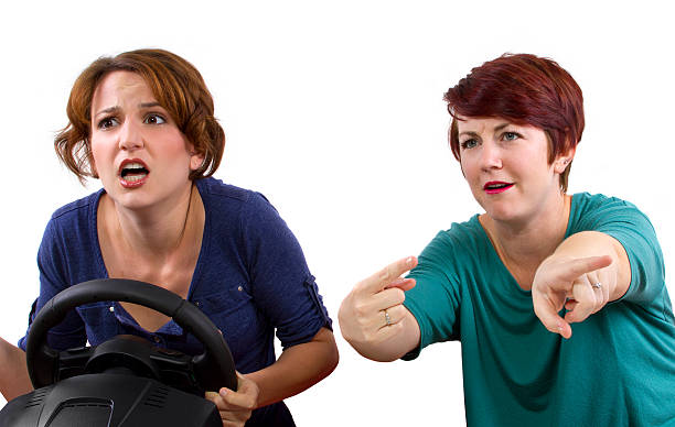 istock Annoying female passenger by being a backseat driver 186337360