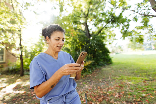 istock Healthcare professional with cellphone during her break time 1863392572
