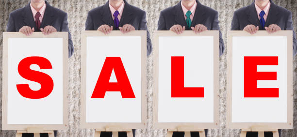 istock businessman show SALE text 186339368