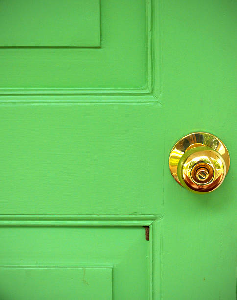 istock Gold door knob on green 186339369