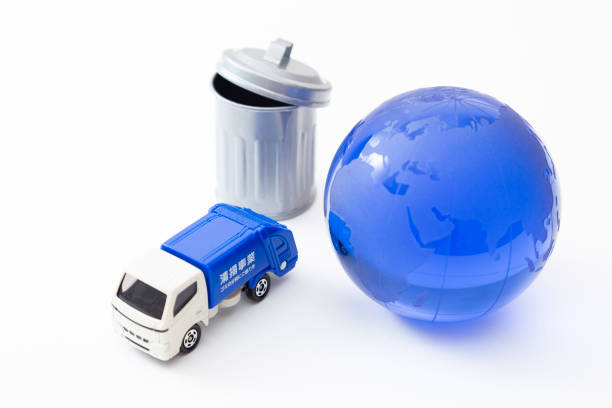 istock Garbage truck, trash can and earth. 1863395937