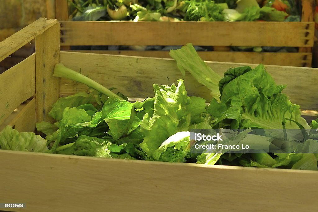 Organic waste in wood case. Vegetables grown in the fields of Puglia. Agricultural Occupation Stock Photo