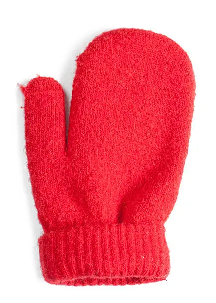 Red baby mitten isolated over white background