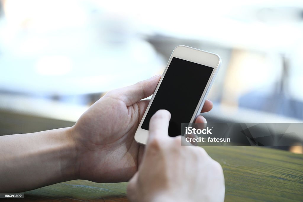 Touching smartphone - Foto de stock de Accesibilidad libre de derechos