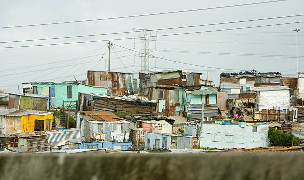 Township Homes, South Africa A view of an informal settlement or township near Cape Town, South Africa. The small homes are built of scraps of tin and plywood to provide shelter. apartheid stock pictures, royalty-free photos & images