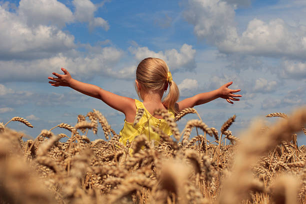 istock Girl in wheat field 186342004