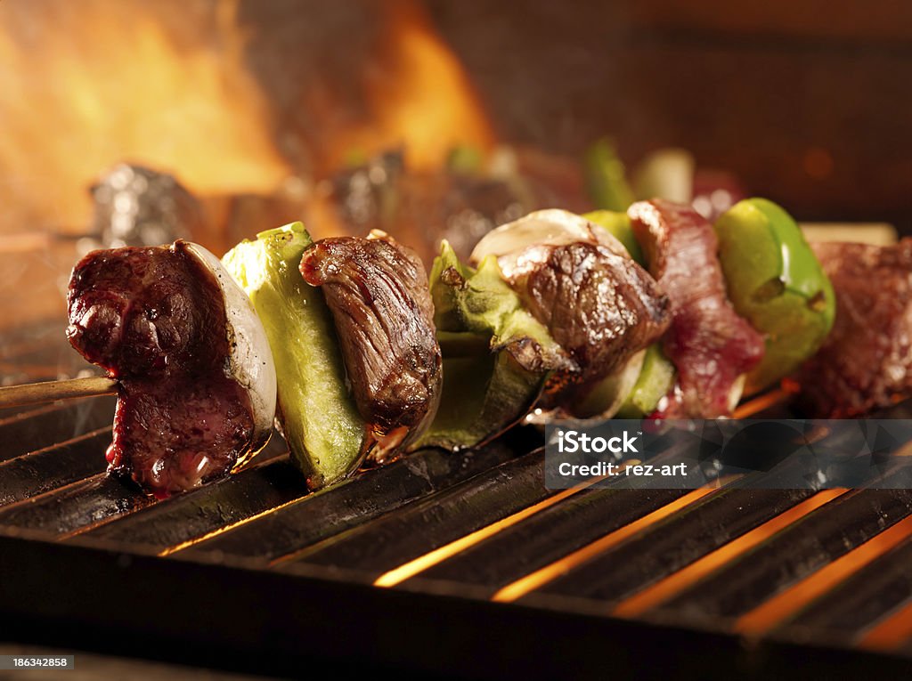 beef shishkababs on the grill close up close up photo of two beef shishkababs on the grill Barbecue Grill Stock Photo